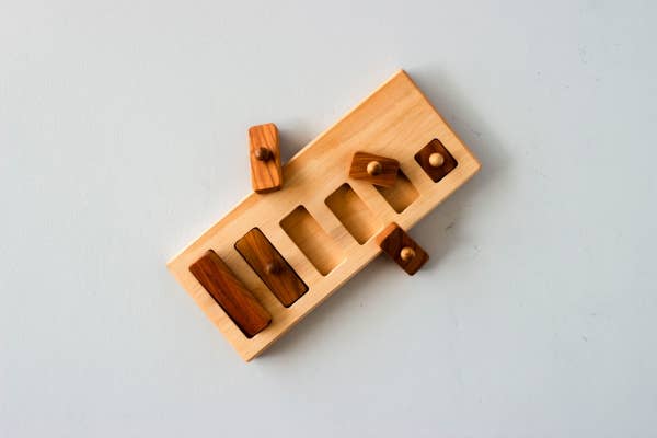 wooden story | lang-kort knoppuzzel